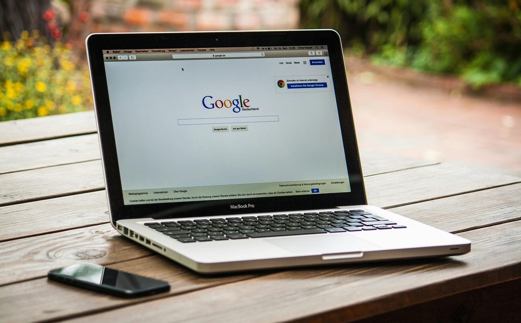 A laptop with the browser open to Google search
