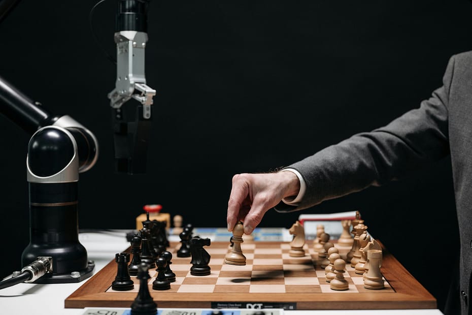 A man playing chess with an AI robot. a metaphor for SEO strategy